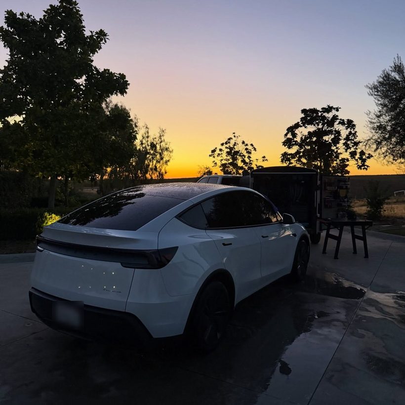 White Tesla at sunset after a maintenance detail