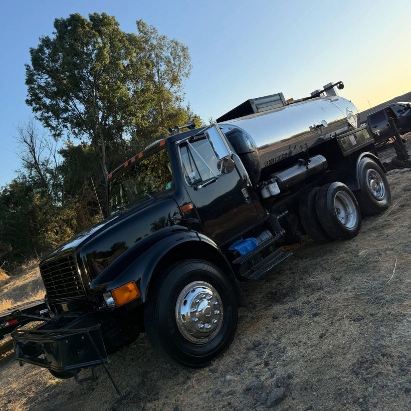 Black work truck with a polished tank